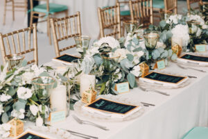 event dining table with elegant place setting and floral display